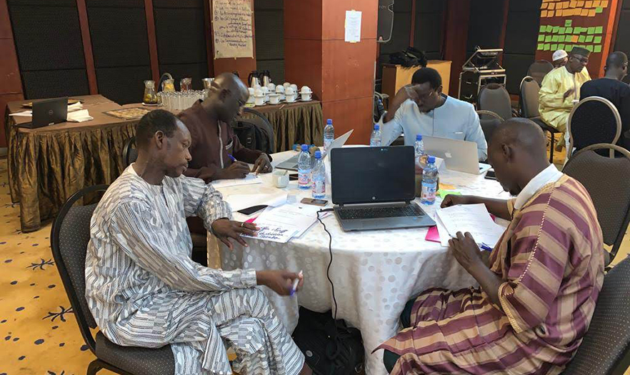 Participants working on developing curriculum at a capacity-building workshop