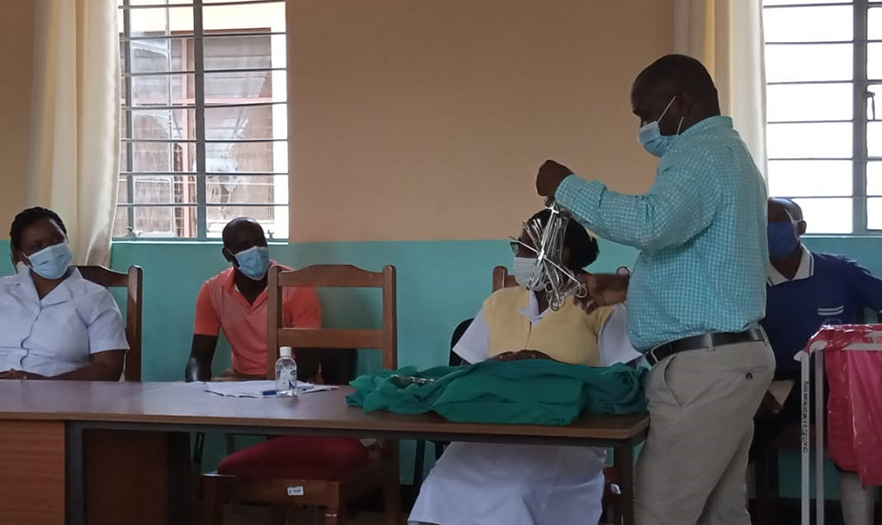 Health worker demonstrates how to package instruments in a way that will help prevent infections at the facility. 
