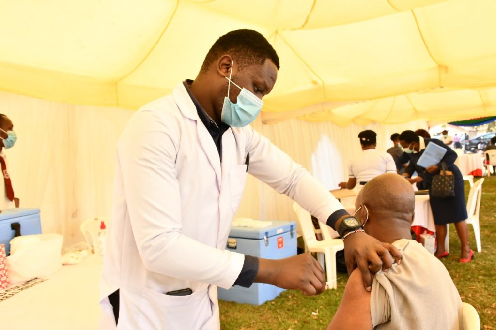Newton-Njenga-a-nurse-in-Kiambu-County-vaccinating-a-client-during-launch-of-accelerated-COVID-19-vaccination-Campaign-in-Kiambu-