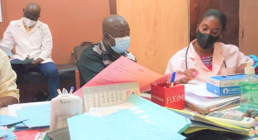 Two people reviewing documents at a desk