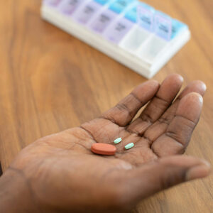 A hand holding medicines