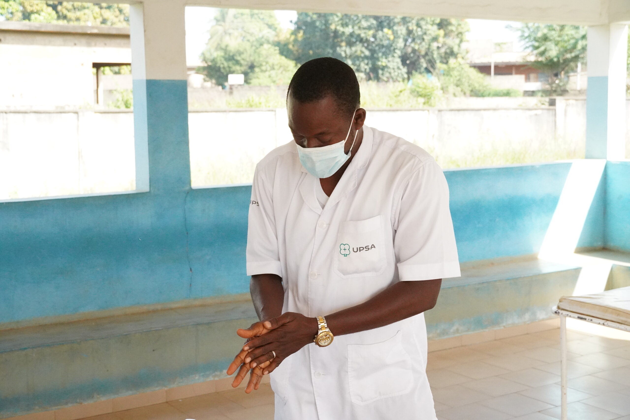 A health worker practicing hand washing